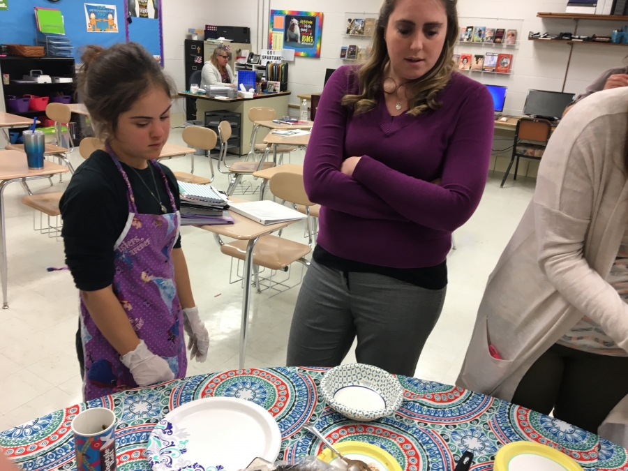 a woman and a child in purple shirts